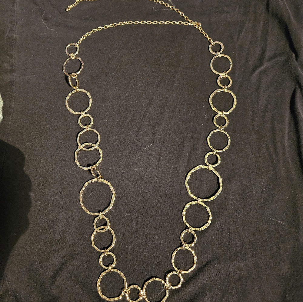 Women's long necklace. Gold tone. Could also be worn as a loose belt. Fun design